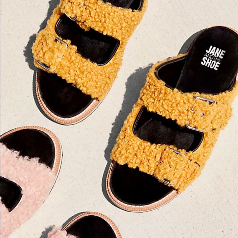 Jane Shoe Faux Shearling Buckled Strap Slide Sandals